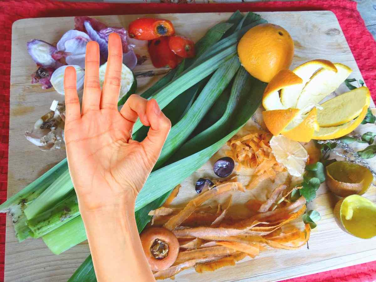 sfondo bucce verdure e mano che fa ok